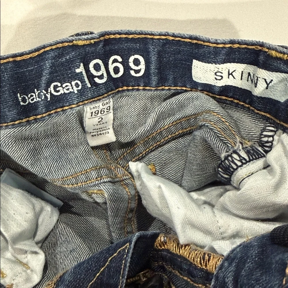GAP Kids Jeans in Blue and Gray. One red H&M pair.